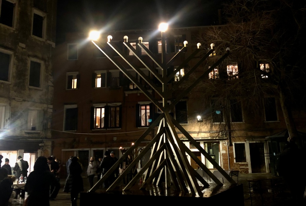 A giant hanukkiah in the square of the Venice ghetto is lit with one electric bulb for the first night of Hanukkah.